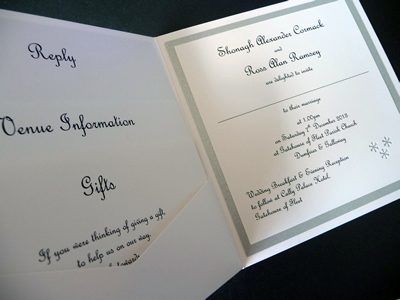 Silver and white pocketcard wedding invitation with a snowflake theme