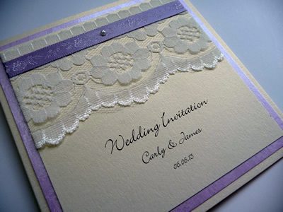 Ivory & Lilac folded wedding invitation with lace above the wording