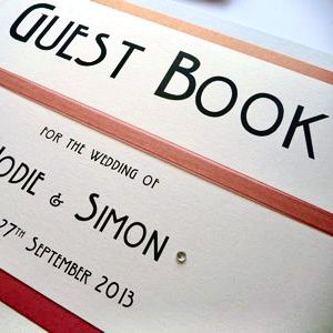 Bright Wedding Guest Book with a coral orange and art deco style font