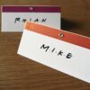 orange and pink friends themed name place cards