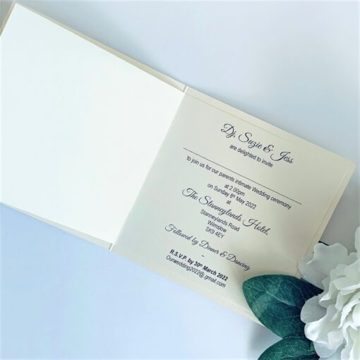 classic folded invitation with pretty floral wreath