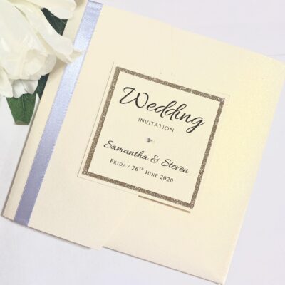 Ivory Pearlised Pocketfold Wedding Invitation with Blue Ribbon and Gold Glitter