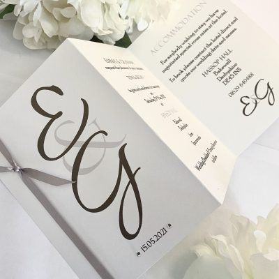 Large initials concertina invitation with knotted ribbon