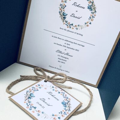 navy gatefold with rustic wreath plaque