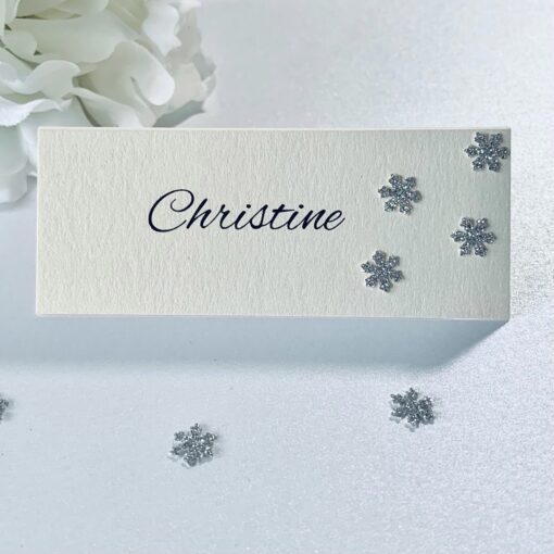Ivory pearlised place card with silver glitter snowflakes