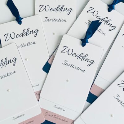 loop tied invitations with navy and blush pink