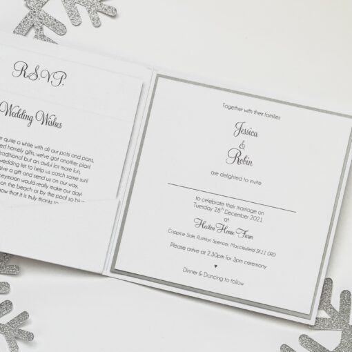 white and silver snowflake pocketfold with ribbon and buckle