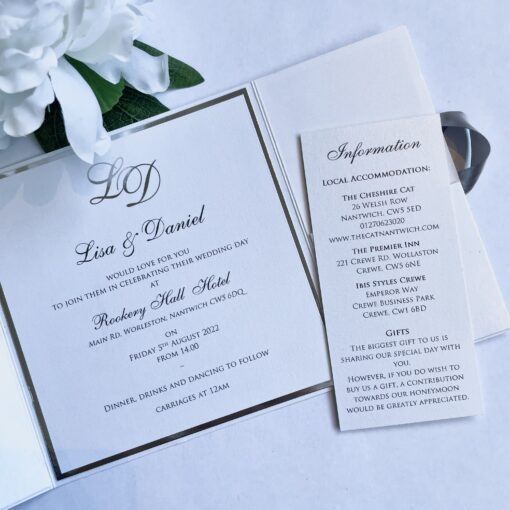 gatefold invitation with silver foiled monogram design