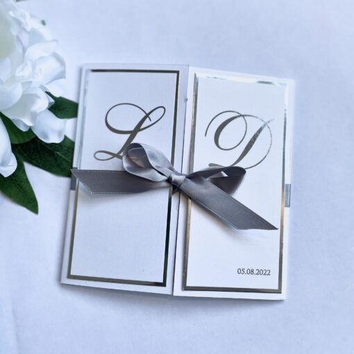 Luxury gatefold invitation with silver foiled intials