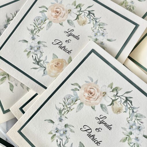 classic folded invitation with pretty floral wreath
