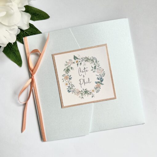 pretty pearlised pocketfold invitation wild flower wreath