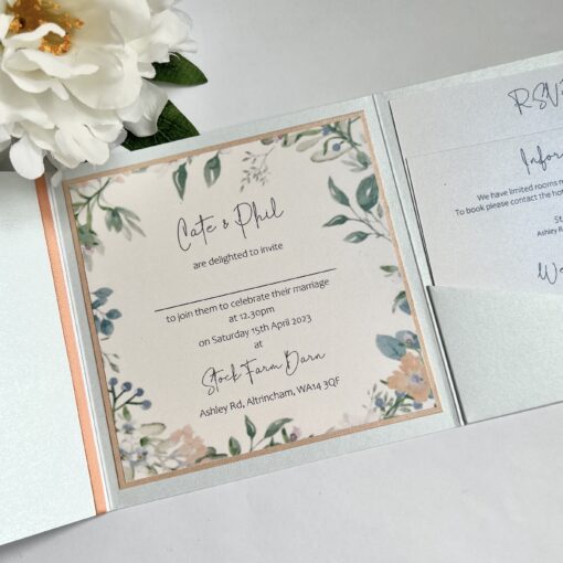 pretty parlised pocketfold invitation wild flower wreath and peach ribbon