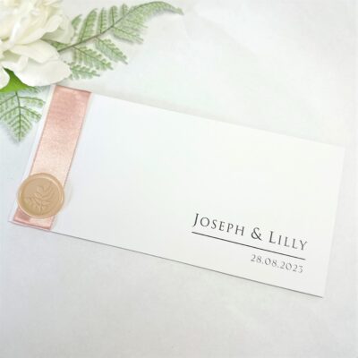 Chequebook invitation with blush ribbon and wax seal