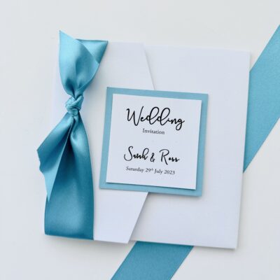 White and Blue Pearlised Pocketfold Wedding Invitation with Wide Ribbon Bow