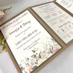 Rustic folded wedding invitation with flower patterns at the base