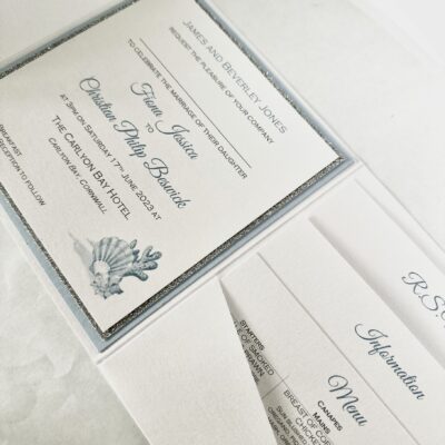 Ice white pocketfold with pale blue and shell design