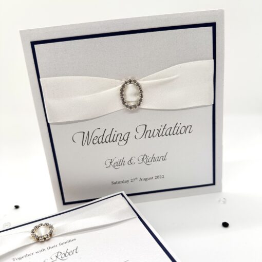 White pearlised pocketfold with navy trim and diamante buckle (1)