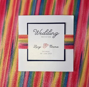 rainbow themed wedding invitation