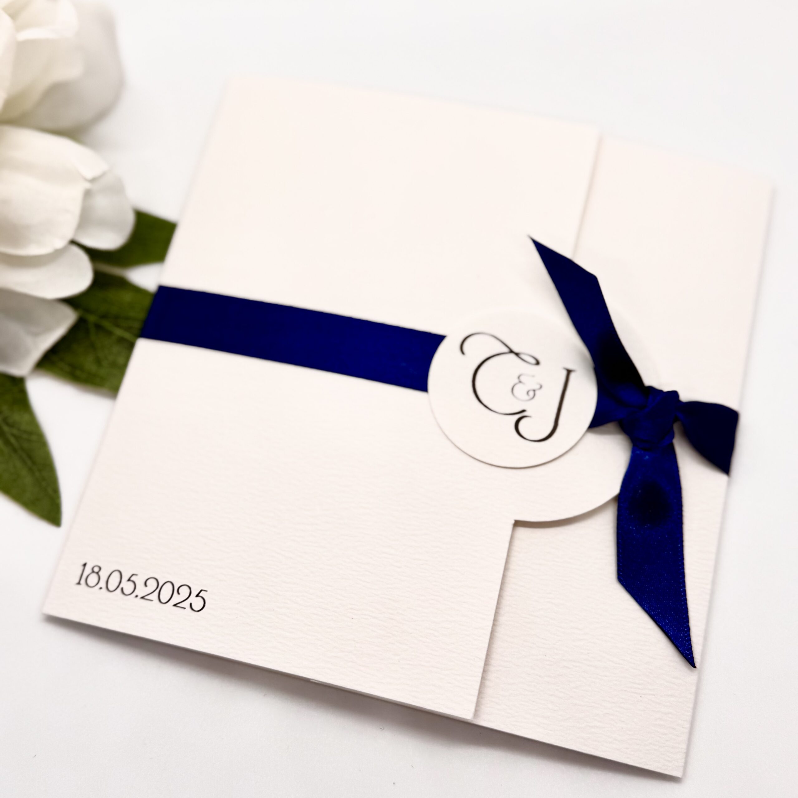Folded Invitation with personalised initials and knotted ribbon