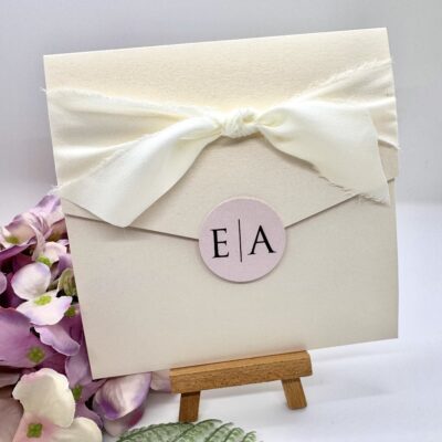 Contemporary Ivory and blush pink pocketfold invitation with timeline