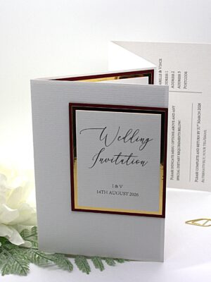 Concertina folded invittaion with burgundy and gold