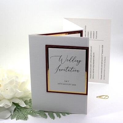 Concertina folded invittaion with burgundy and gold