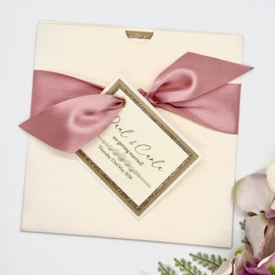 Ivory Wallet Invitation with pink ribbon and tag