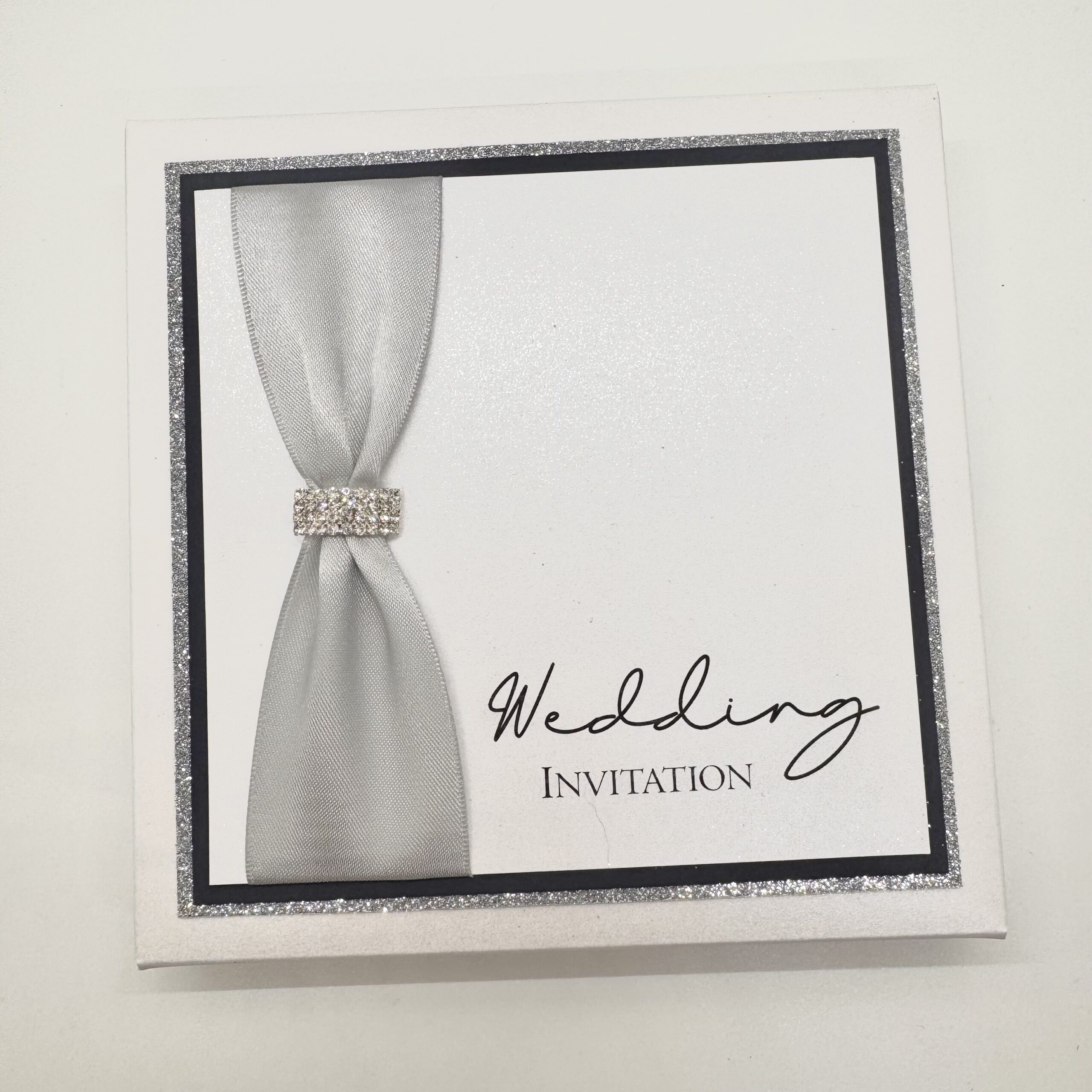 Luxury Folded invitation with buckle detail and matching box